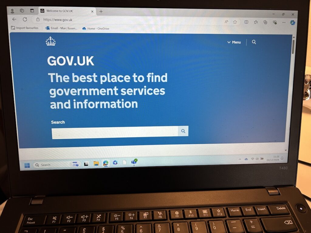 A laptop accessing the Gov.uk website.